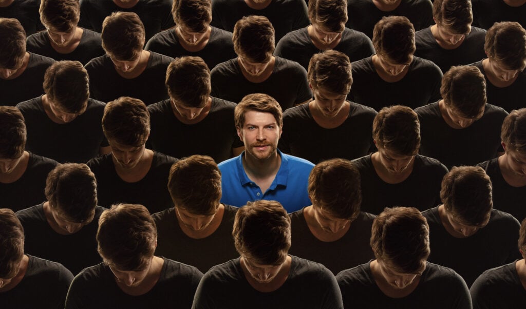 Top view of grey crowd of identical people and special one man, difference and diversity concept